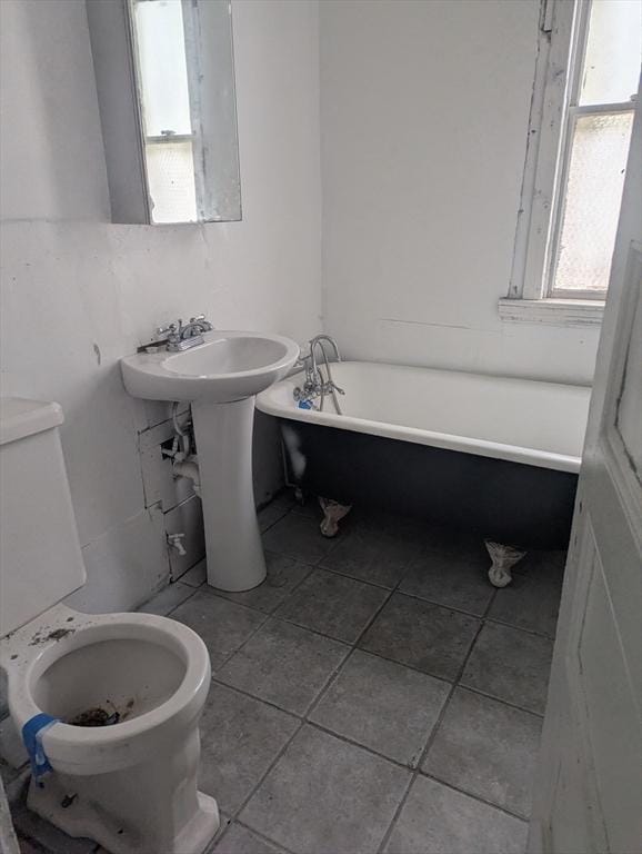 21 Mclellan St, Boston, MA 02121 - full bathroom with a freestanding tub and tile patterned flooring