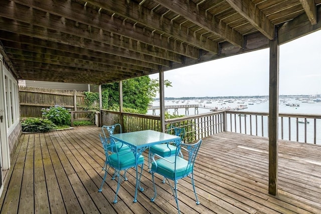 wooden deck with a water view