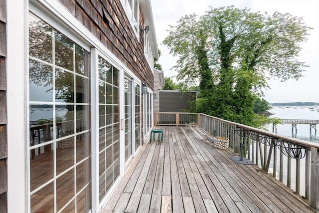 deck featuring a water view