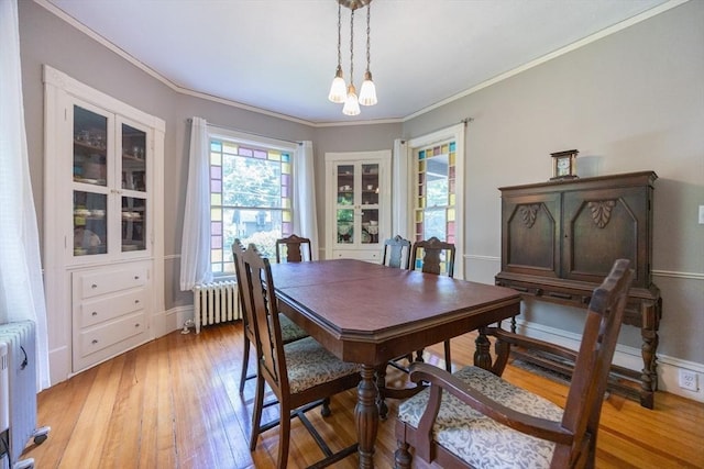 14 Baker St, Foxboro, MA 02035 - dining area with radiator, crown molding, light wood-type flooring, and a chandelier
