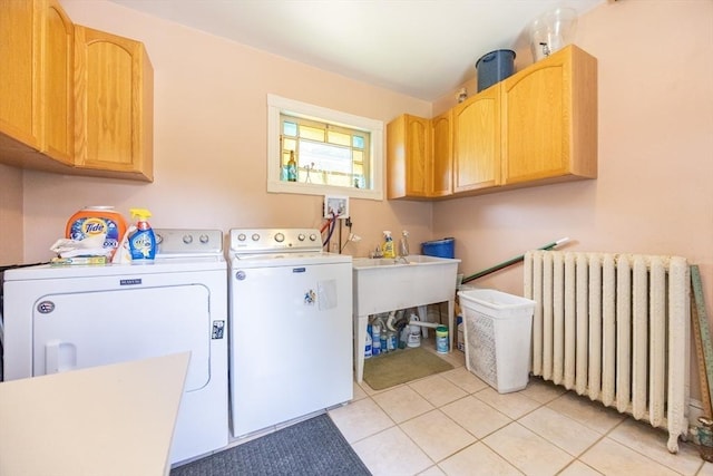 14 Baker St, Foxboro, MA 02035 - laundry area featuring radiator heating unit, cabinet space, washer and clothes dryer, and light tile patterned floors