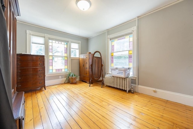 14 Baker St, Foxboro, MA 02035 - spare room with radiator heating unit, hardwood / wood-style flooring, and crown molding