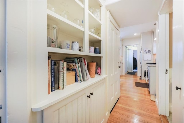 14 Baker St, Foxboro, MA 02035 - corridor featuring light wood finished floors and built in shelves
