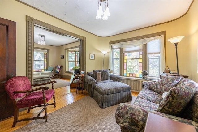14 Baker St, Foxboro, MA 02035 - living area with wood finished floors, plenty of natural light, and a chandelier