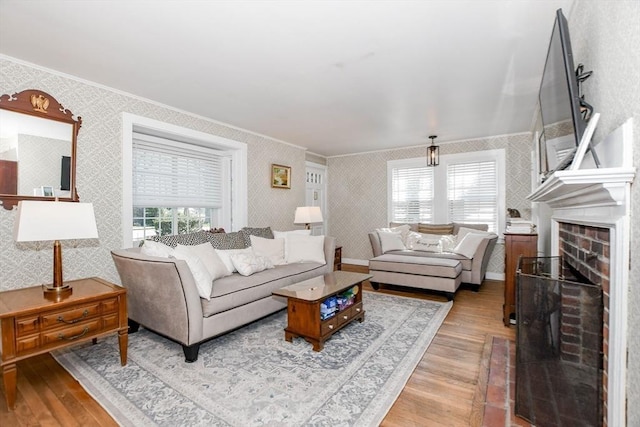 54 Converse Rd, Marion, MA 02738 - living room with wallpapered walls, crown molding, wood finished floors, and a brick fireplace