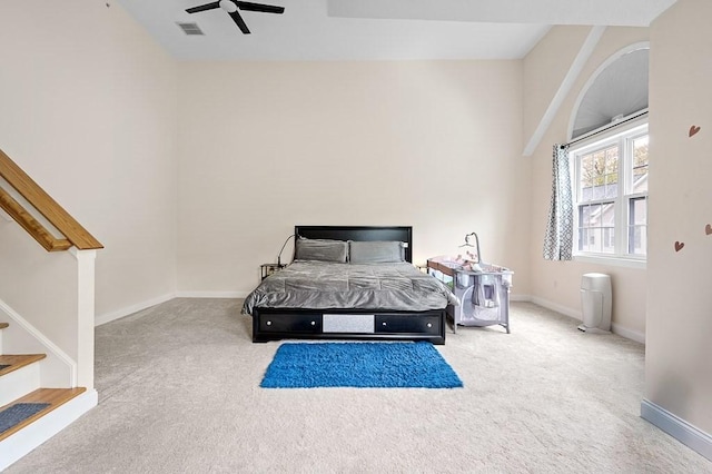 bedroom featuring carpet, baseboards, and a ceiling fan