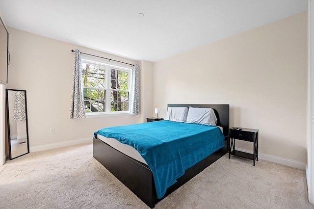 bedroom with baseboards and carpet flooring