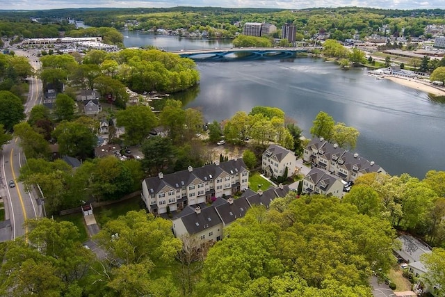 drone / aerial view of a nearby body of water and a notable bridge
