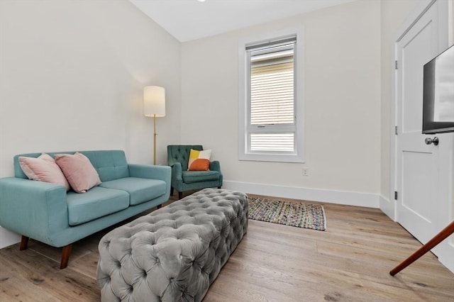 living room featuring light wood-style floors and baseboards