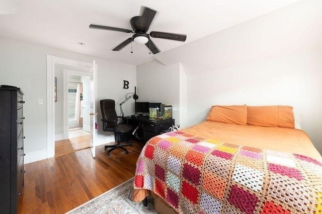 bedroom with a ceiling fan and wood finished floors