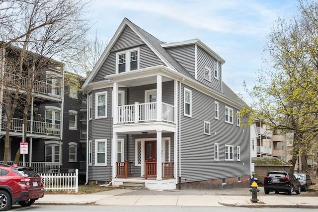 view of front of property with a balcony