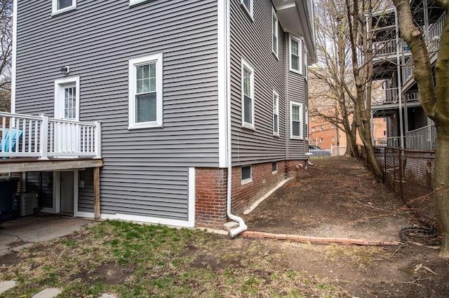 view of home's exterior featuring fence
