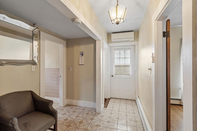 corridor with baseboards, baseboard heating, light floors, and a wall unit AC