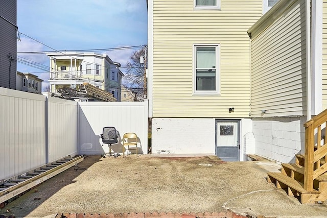 view of side of property with a patio area and a fenced backyard