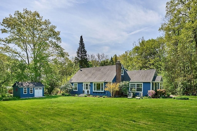 6 Valley View Rd, Williamsburg, MA 01096 - view of front of house featuring a front lawn, a chimney, and an outdoor structure