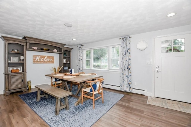 8 Highland View Ave, Mattapoisett, MA 02739 - dining area featuring baseboard heating, wood finished floors, a textured ceiling, and recessed lighting