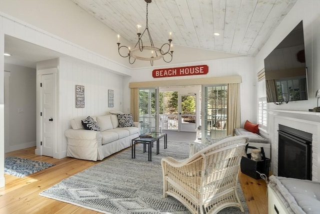 16 Walking Stick, Plymouth, MA 02360 - living area with a chandelier, lofted ceiling, wood finished floors, wood ceiling, and a glass covered fireplace