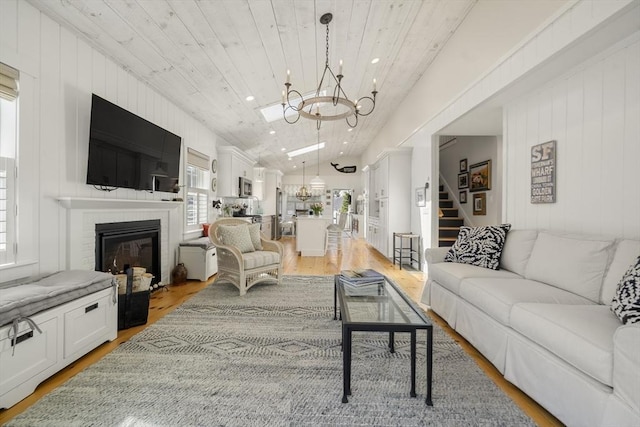 16 Walking Stick, Plymouth, MA 02360 - living area featuring a chandelier, healthy amount of natural light, light wood-style flooring, stairway, and wood ceiling
