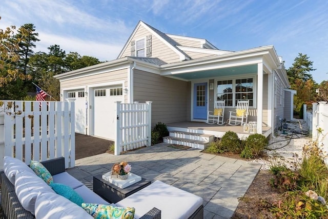 16 Walking Stick, Plymouth, MA 02360 - view of front of house with covered porch, an outdoor hangout area, and an attached garage