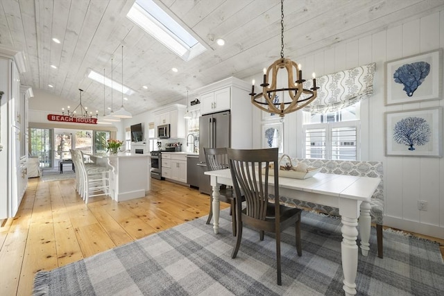 16 Walking Stick, Plymouth, MA 02360 - dining area featuring a chandelier, a skylight, light wood-type flooring, recessed lighting, and wooden ceiling
