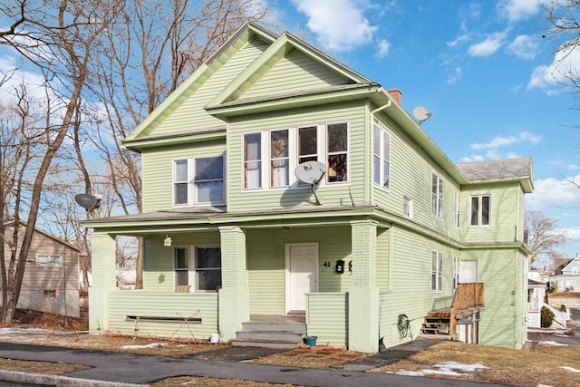 view of property featuring a porch