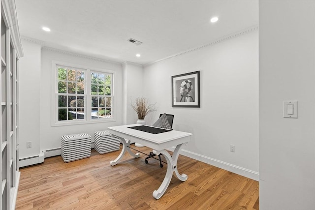 office area with a baseboard radiator, ornamental molding, and light wood-type flooring