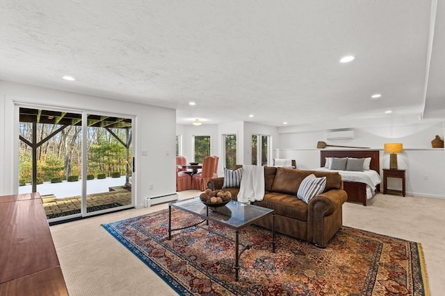 carpeted living room with an AC wall unit, a baseboard heating unit, and a textured ceiling