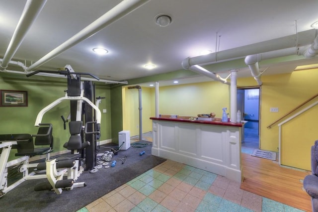 workout area with baseboards and recessed lighting