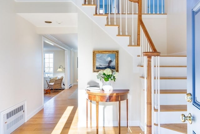 6 Snow Way, Orleans, MA 02653 - staircase featuring wood finished floors, baseboard heating, radiator, and baseboards