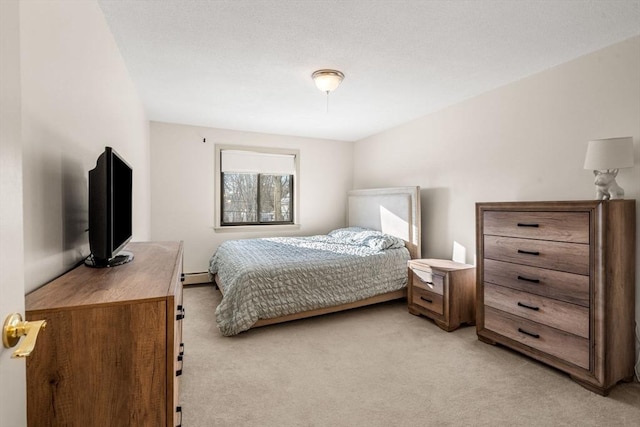 bedroom featuring a baseboard radiator and light carpet