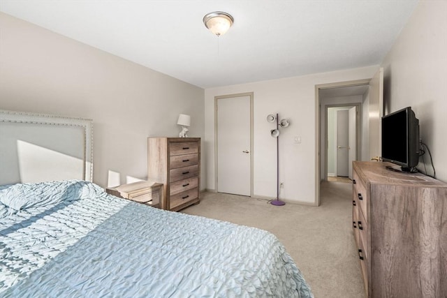 bedroom featuring light carpet