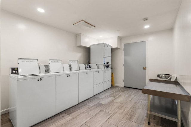 washroom with stacked washer / dryer and washer and clothes dryer