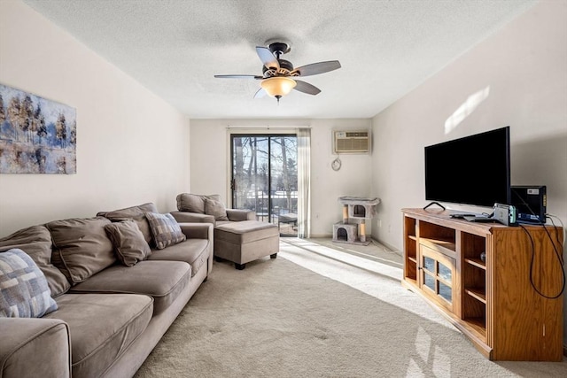 carpeted living room with ceiling fan, a wall mounted air conditioner, and a textured ceiling