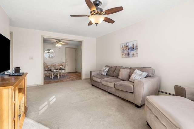 living room with ceiling fan, light carpet, and baseboard heating