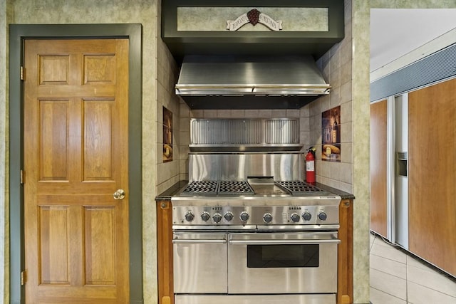 116 Adin St, Hopedale, MA 01747 - kitchen featuring double oven range, decorative backsplash, wall chimney exhaust hood, refrigerator with ice dispenser, and light tile patterned flooring