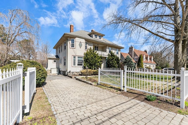 116 Adin St, Hopedale, MA 01747 - american foursquare style home with a chimney and a fenced front yard