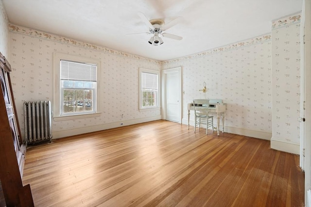 116 Adin St, Hopedale, MA 01747 - unfurnished room with radiator, wood finished floors, ceiling fan, wallpapered walls, and baseboards