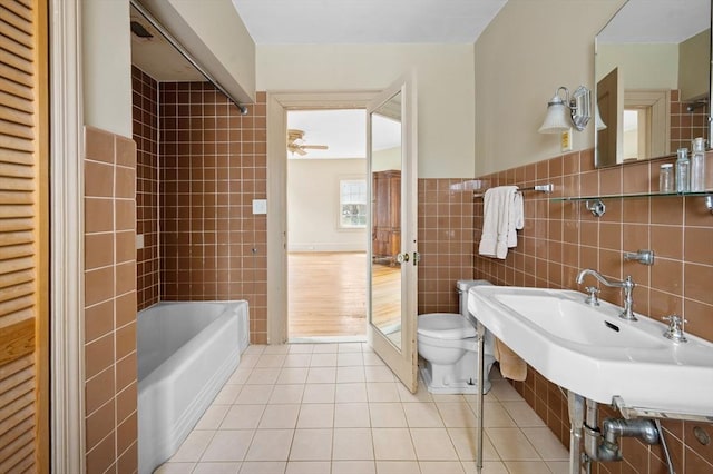 116 Adin St, Hopedale, MA 01747 - bathroom featuring tile walls, tile patterned flooring, toilet, and a sink