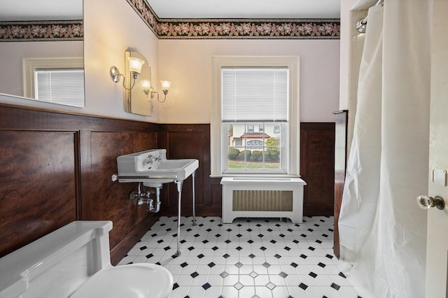 116 Adin St, Hopedale, MA 01747 - bathroom with radiator, a wainscoted wall, toilet, curtained shower, and a sink