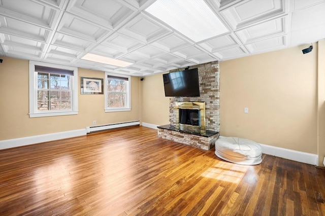 116 Adin St, Hopedale, MA 01747 - unfurnished living room with a baseboard heating unit, baseboards, wood finished floors, and a fireplace