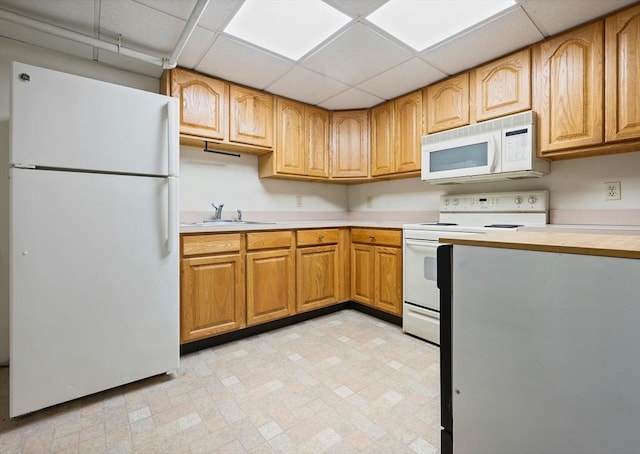 116 Adin St, Hopedale, MA 01747 - kitchen with white appliances, light countertops, a sink, a drop ceiling, and light floors