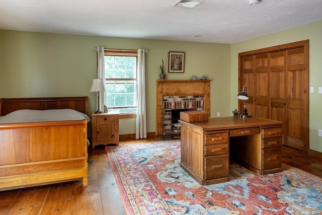 29 Miscoe Rd, Mendon, MA 01756 - bedroom featuring hardwood / wood-style flooring and a fireplace