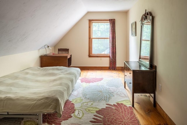 29 Miscoe Rd, Mendon, MA 01756 - bedroom featuring light wood finished floors and vaulted ceiling