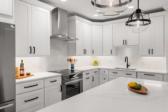 18 Franklin Unit 202, Salem, MA 01970 - kitchen with wall chimney exhaust hood, a sink, stainless steel appliances, white cabinetry, and pendant lighting