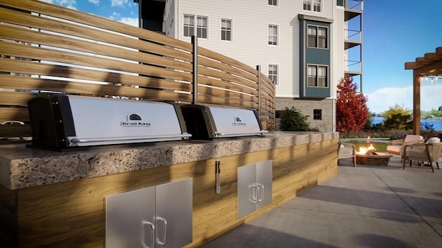 18 Franklin Unit 202, Salem, MA 01970 - view of patio featuring an outdoor fire pit and area for grilling