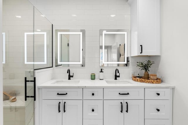 18 Franklin Unit 202, Salem, MA 01970 - bathroom with double vanity, decorative backsplash, and a stall shower