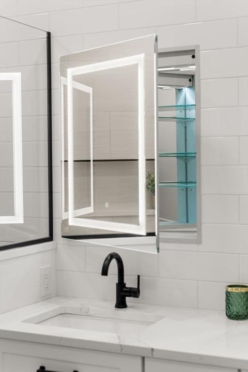 18 Franklin Unit 202, Salem, MA 01970 - bathroom featuring vanity and decorative backsplash