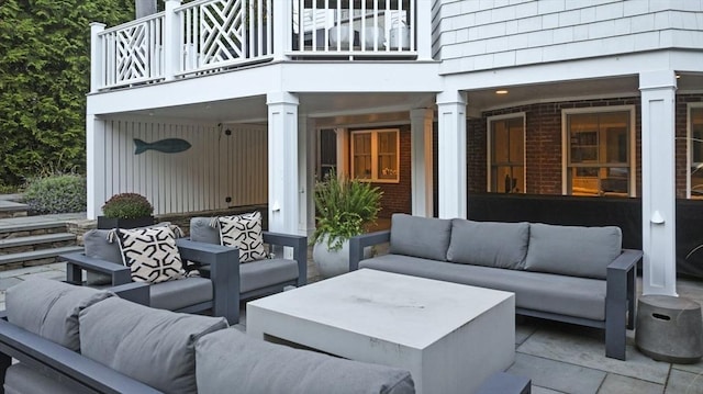 view of patio / terrace featuring a balcony and outdoor lounge area
