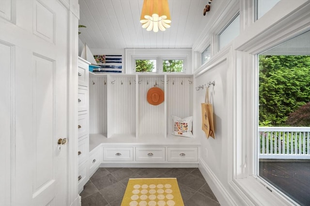 mudroom with baseboards, dark tile patterned flooring, a chandelier, and wooden ceiling