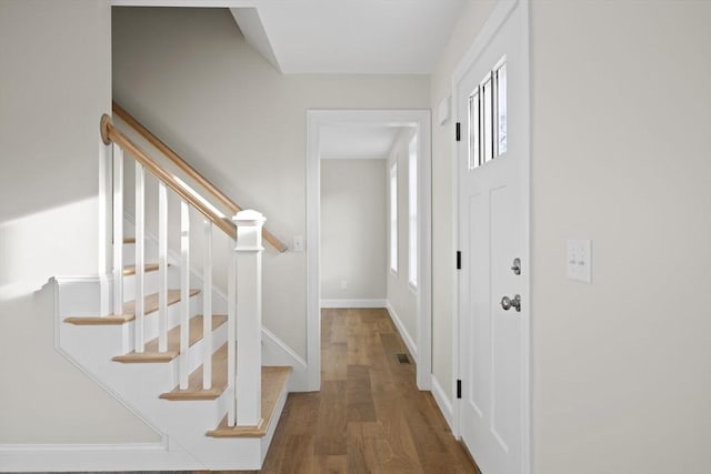 foyer entrance with dark hardwood / wood-style flooring